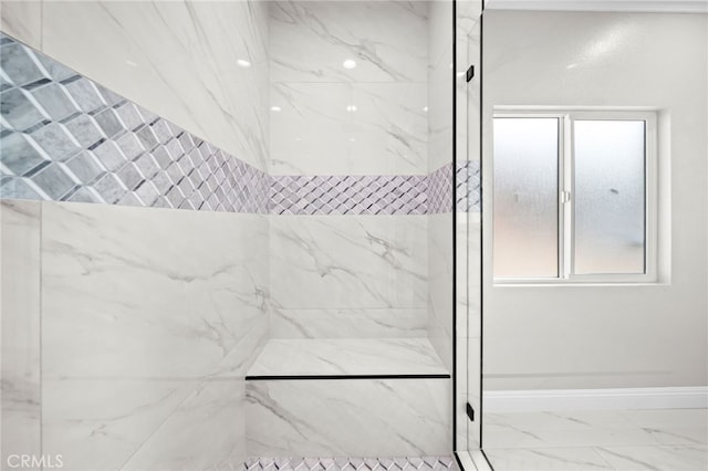 bathroom featuring tiled shower