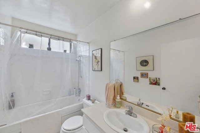 full bathroom with toilet, vanity, and tiled shower / bath