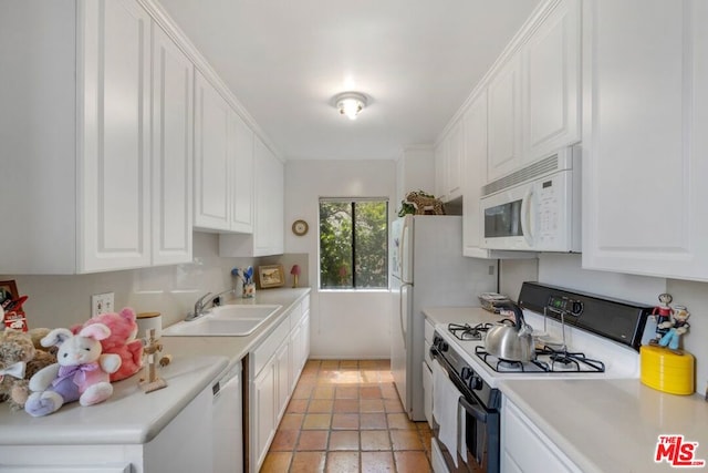 kitchen featuring white cabinetry, white appliances, and sink