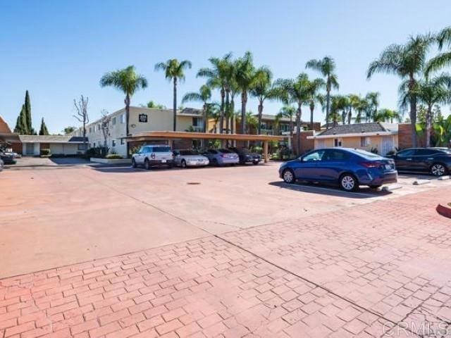 view of vehicle parking featuring a carport