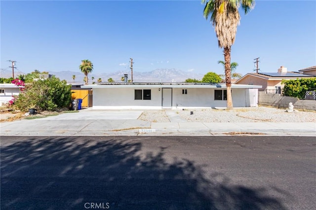 single story home with a mountain view