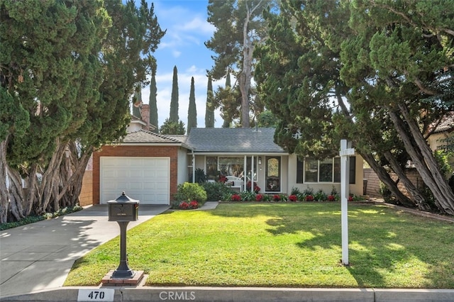 ranch-style home with a garage and a front yard