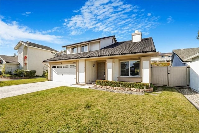 view of front of property featuring a front yard and a garage