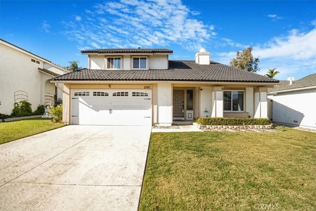 view of front of property featuring a front lawn and a garage