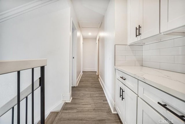 corridor featuring wood-type flooring