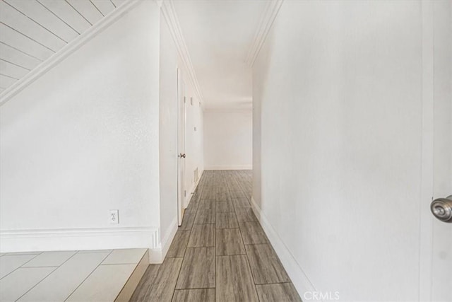 corridor featuring ornamental molding