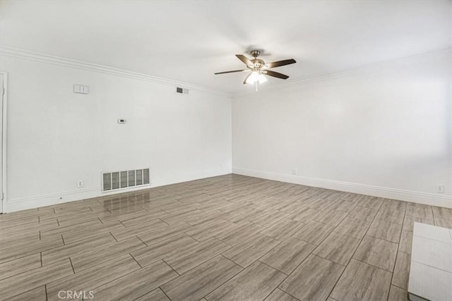 spare room with ceiling fan and ornamental molding