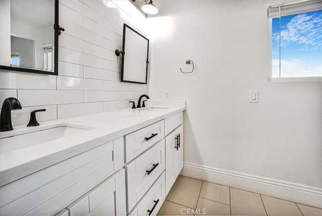 bathroom with decorative backsplash and vanity