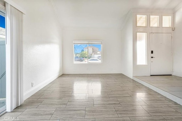 foyer featuring ornamental molding