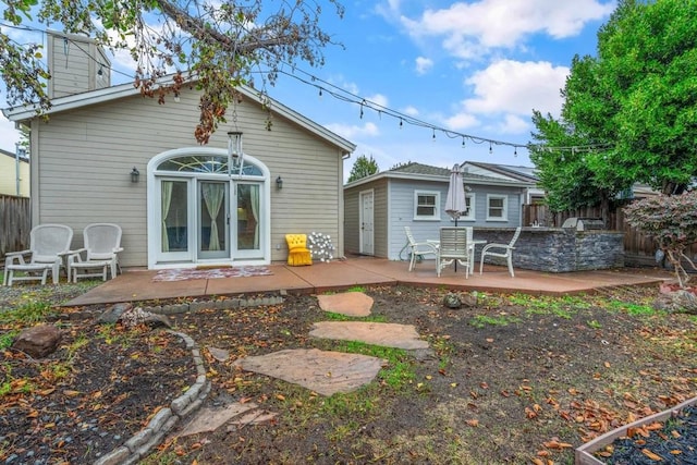 rear view of property featuring a patio