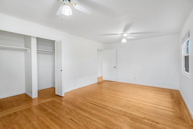 unfurnished bedroom featuring ceiling fan, a closet, and light hardwood / wood-style flooring