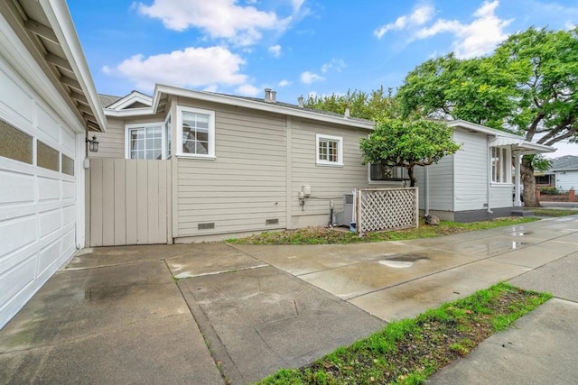 back of property with a garage