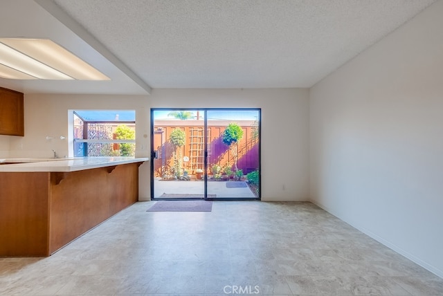 spare room with a textured ceiling