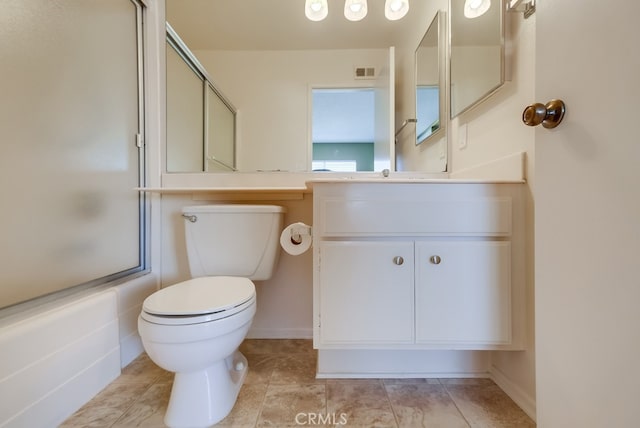 full bathroom with toilet, vanity, bath / shower combo with glass door, and tile patterned flooring