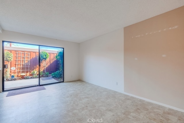 empty room featuring a textured ceiling