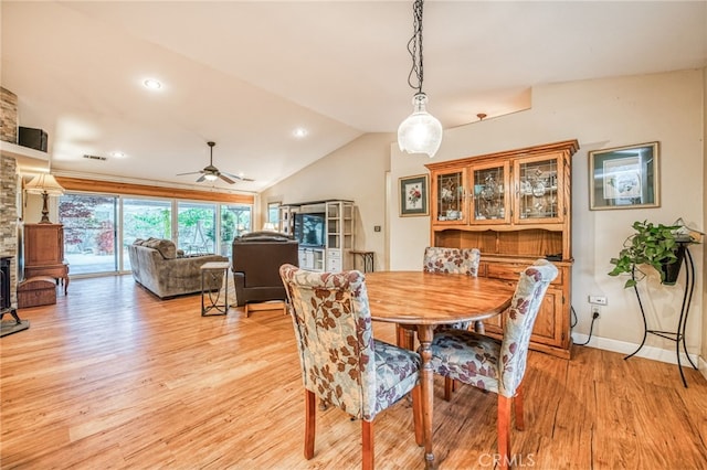 dining area featuring light wood-type flooring, ceiling fan, and lofted ceiling