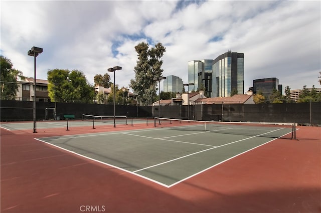 view of sport court featuring basketball hoop