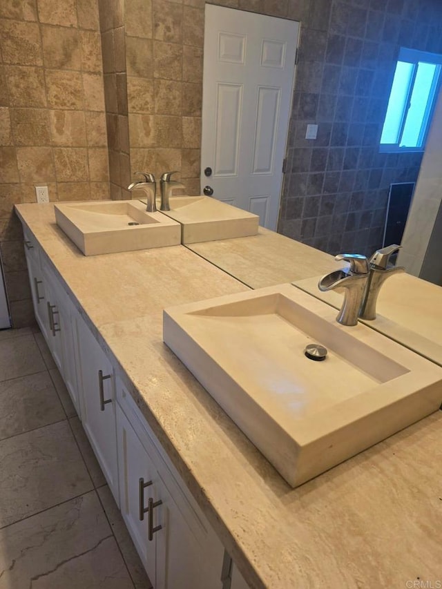 bathroom with tile walls and vanity