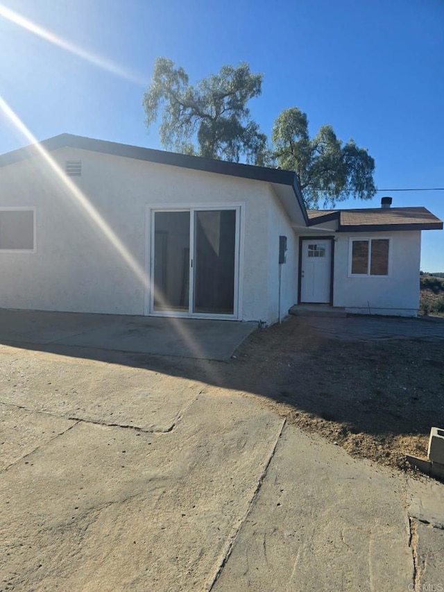 back of property featuring a patio area