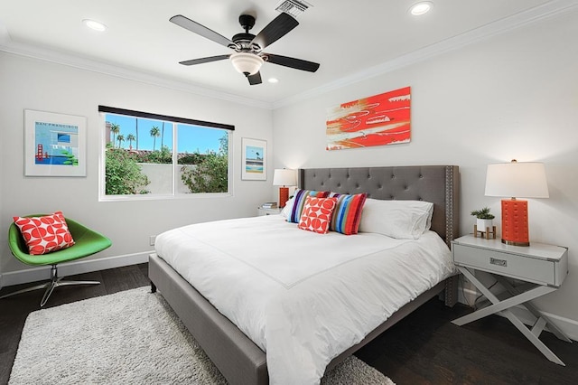 bedroom with dark hardwood / wood-style floors, ceiling fan, and crown molding