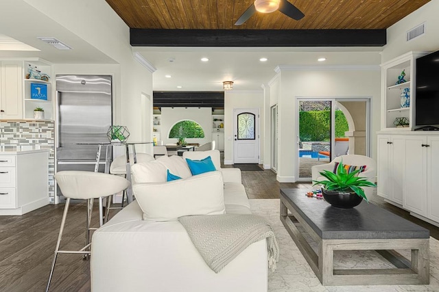 living room featuring beamed ceiling, hardwood / wood-style floors, ceiling fan, and wood ceiling