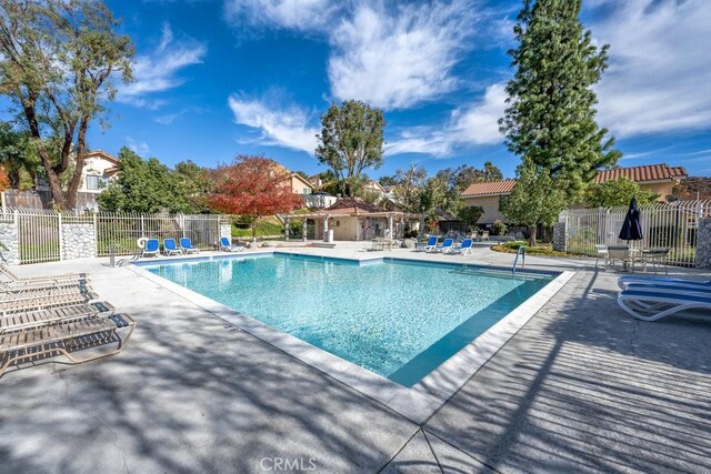 view of swimming pool with a patio area