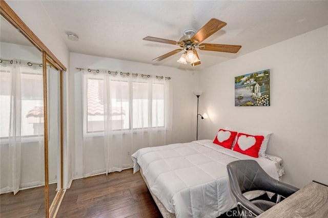 bedroom with ceiling fan and wood finished floors