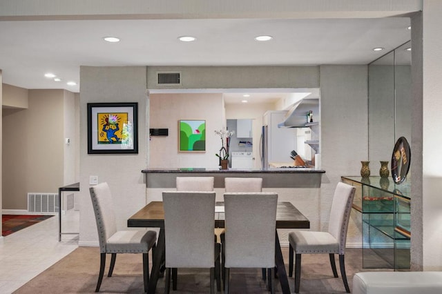 tiled dining space featuring washer / clothes dryer