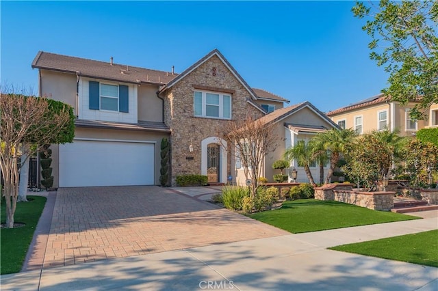 view of front of house with a front lawn and a garage