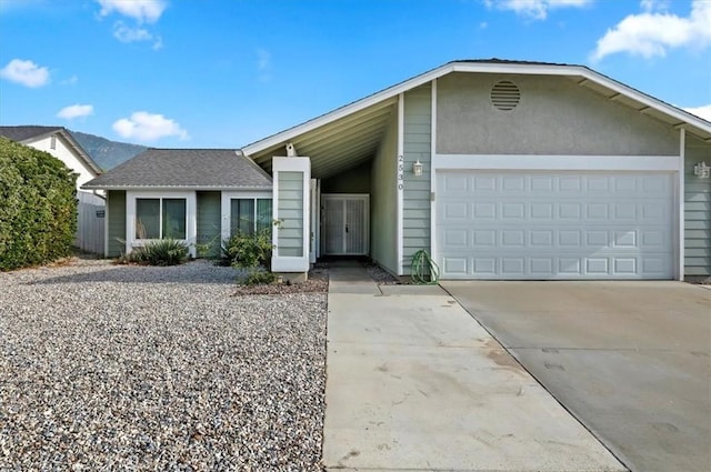 ranch-style house featuring a garage