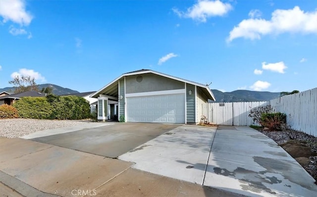 exterior space featuring a mountain view and a garage