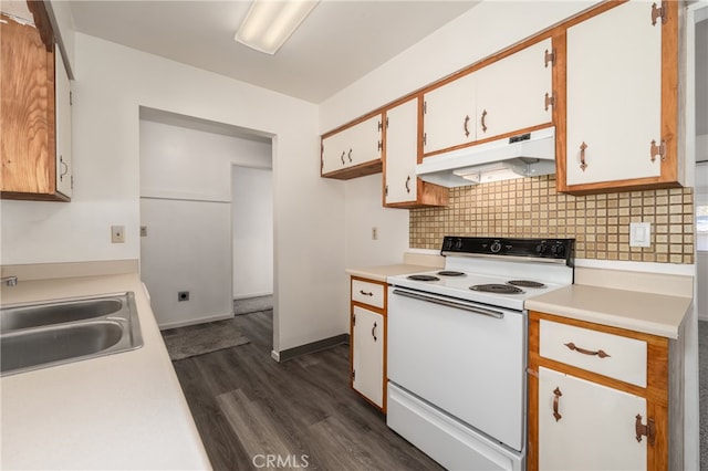 kitchen with electric range, sink, dark hardwood / wood-style flooring, decorative backsplash, and white cabinets