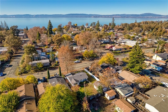 birds eye view of property featuring a water and mountain view