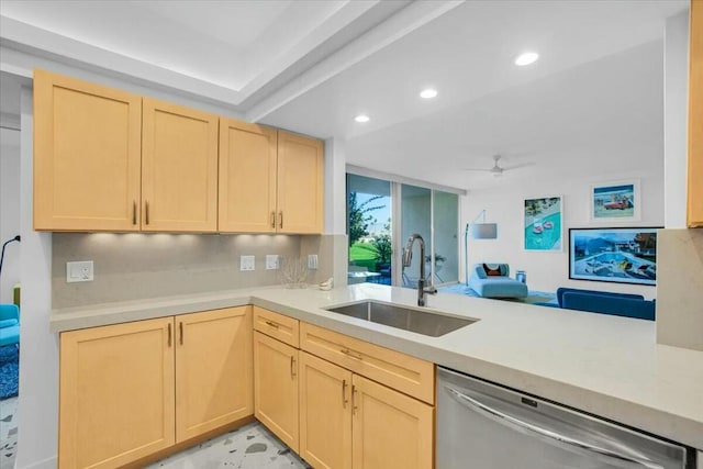 kitchen featuring kitchen peninsula, sink, stainless steel dishwasher, and light brown cabinets