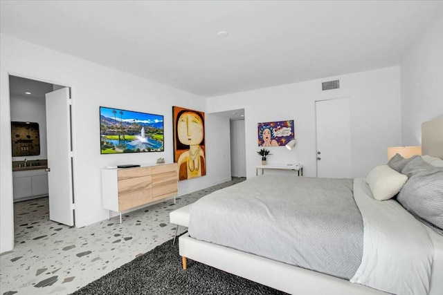 carpeted bedroom with ensuite bathroom