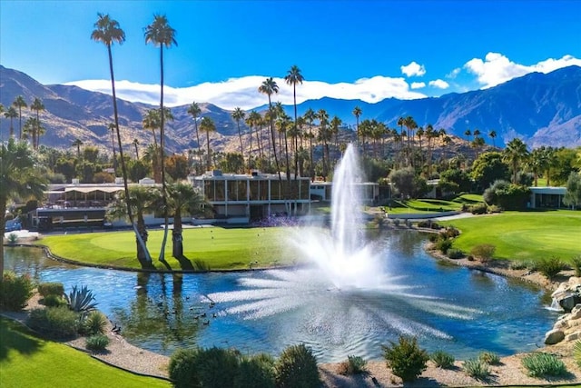 surrounding community with a lawn and a water and mountain view