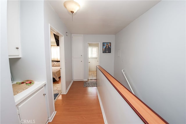 hall with light hardwood / wood-style floors