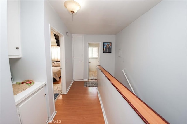 17053 Roscoe Blvd Unit 1, Northridge, CA 91325 - hallway featuring an upstairs landing and light wood-type flooring