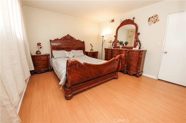 bedroom with light hardwood / wood-style flooring