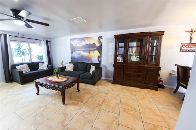 living room with ceiling fan and light tile patterned flooring