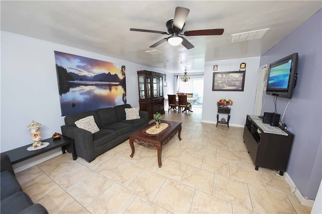 tiled living room featuring ceiling fan