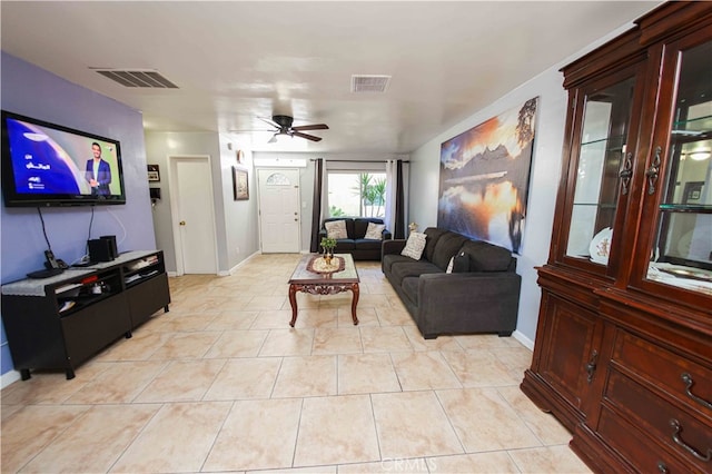 living room with ceiling fan and light tile patterned floors