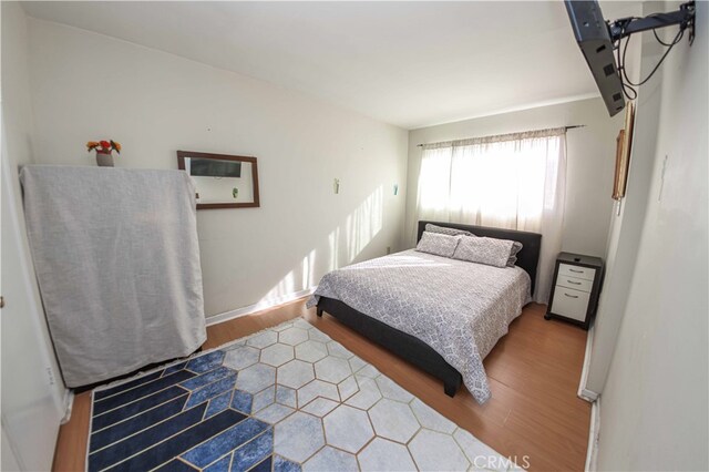 bedroom with light hardwood / wood-style flooring