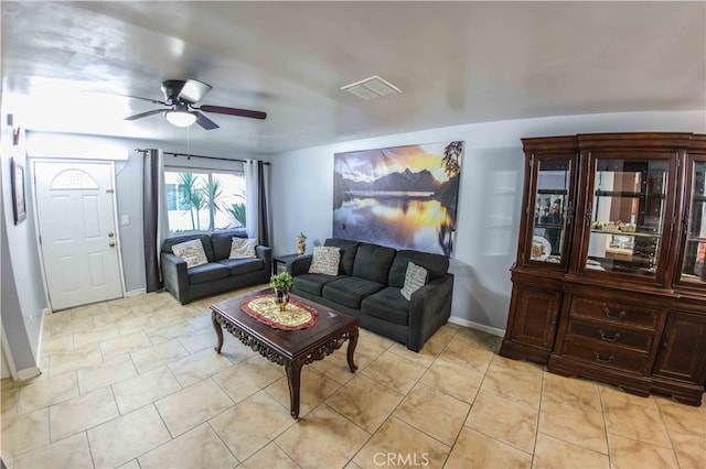 living room featuring ceiling fan and light tile patterned floors