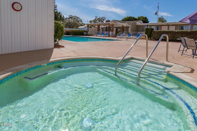 view of swimming pool featuring a patio area