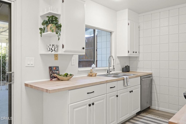 kitchen featuring white cabinets, light hardwood / wood-style flooring, and a wealth of natural light