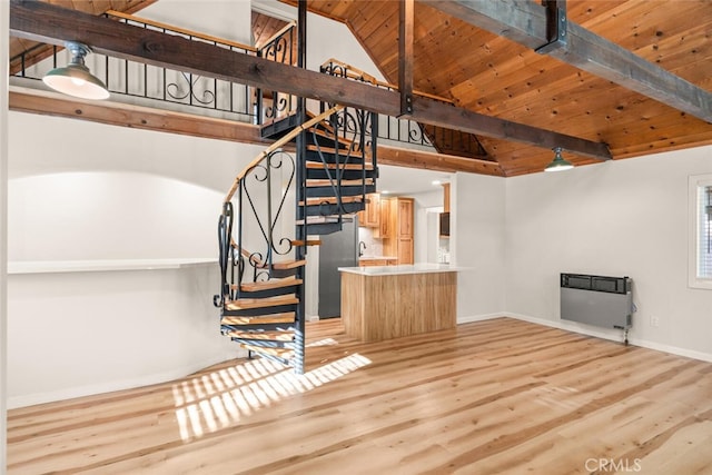 stairs featuring vaulted ceiling with beams, heating unit, wooden ceiling, and wood-type flooring