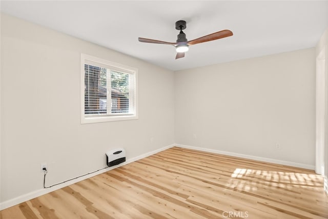 spare room featuring ceiling fan and wood-type flooring