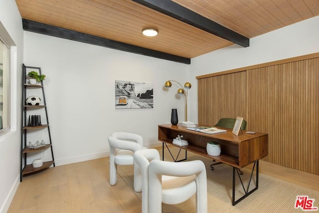 office with light hardwood / wood-style flooring, beamed ceiling, and wooden ceiling