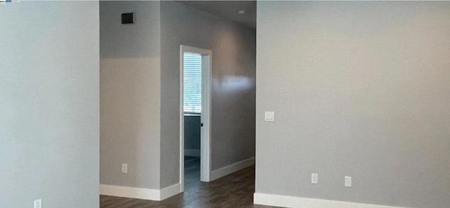 spare room with dark hardwood / wood-style flooring